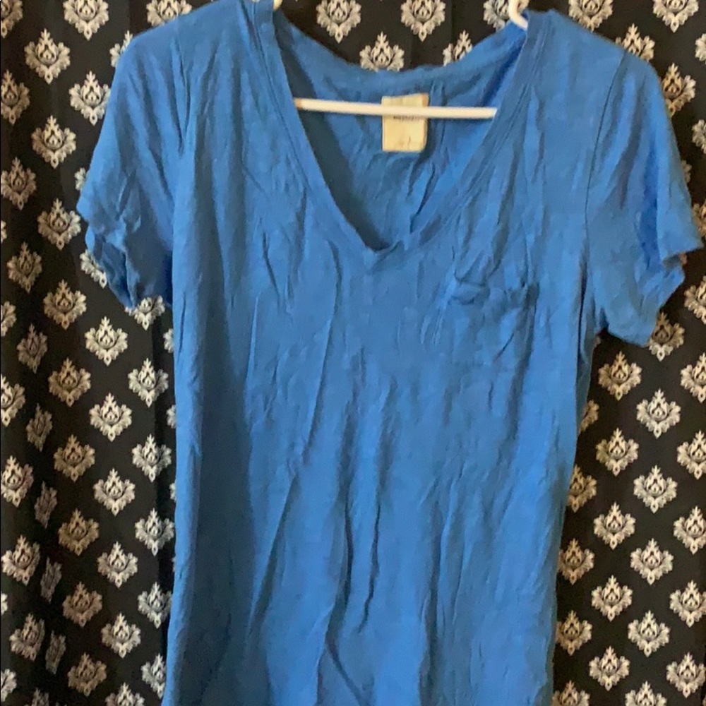 Plain blue tee.
